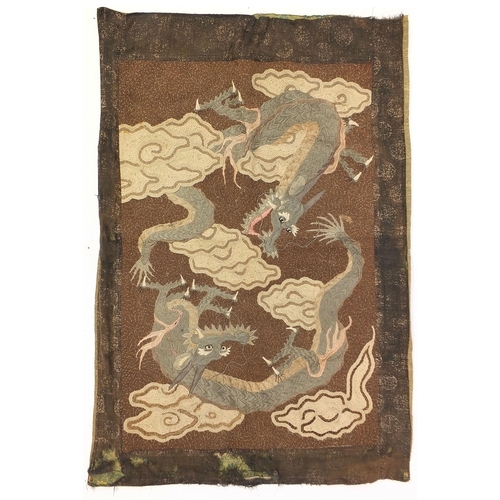 86 - Chinese embroidered wall hanging depicting two three toed dragons amongst clouds, 102cm x 70cm