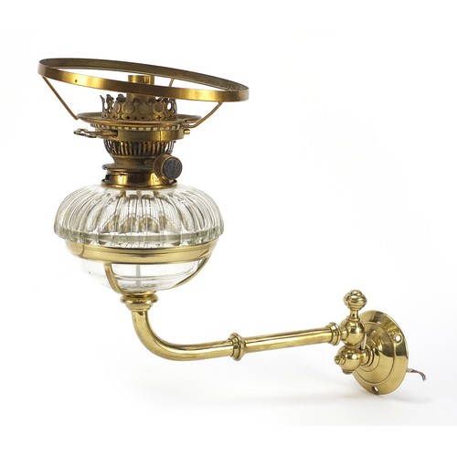 272 - Antique brass and glass converted oil lamp to electric
 use, by Hicks & Son, wall mounted on a swing... 