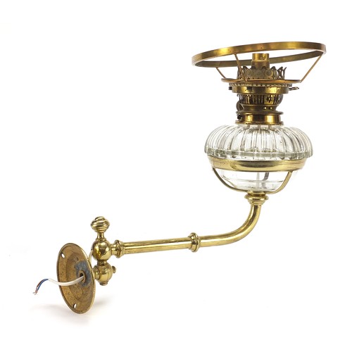 272 - Antique brass and glass converted oil lamp to electric
 use, by Hicks & Son, wall mounted on a swing... 