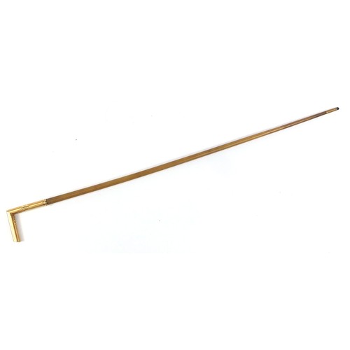 316 - Rhinoceros horn walking stick with unmarked 18ct gold mounts, 78cm in length