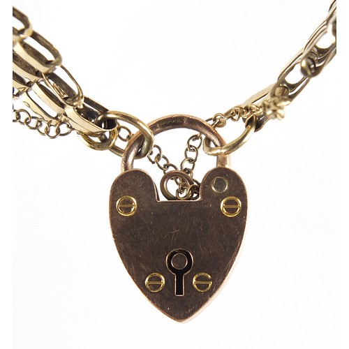 1693 - 9ct gold seven row gate link bracelet with love heart padlock, 16cm in length, 15.2g