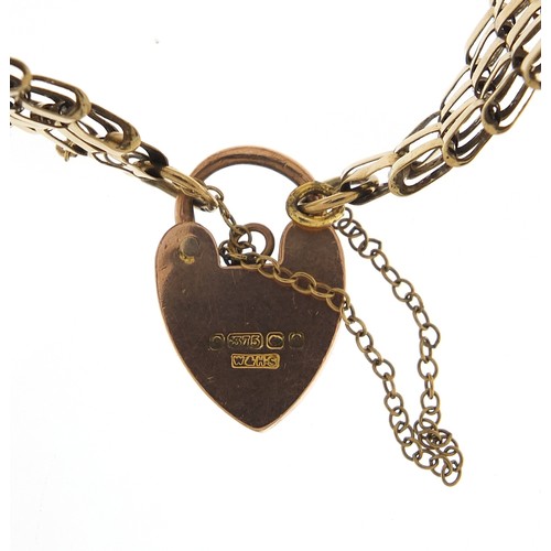 1693 - 9ct gold seven row gate link bracelet with love heart padlock, 16cm in length, 15.2g