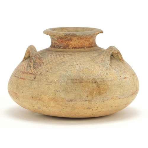 125 - Mycenaean pottery squatted jar with three loop handles, 6.5cm high