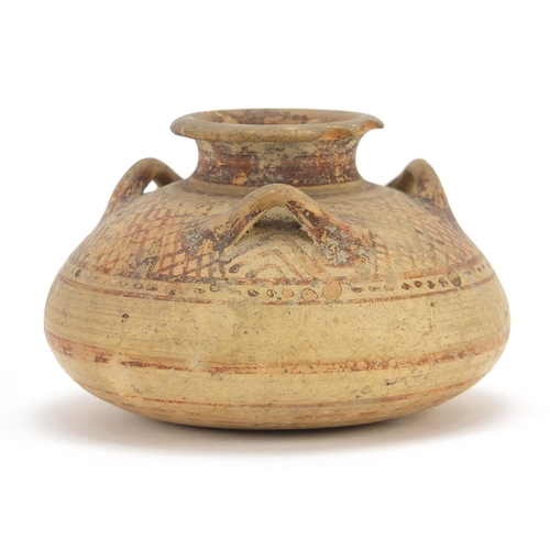 125 - Mycenaean pottery squatted jar with three loop handles, 6.5cm high