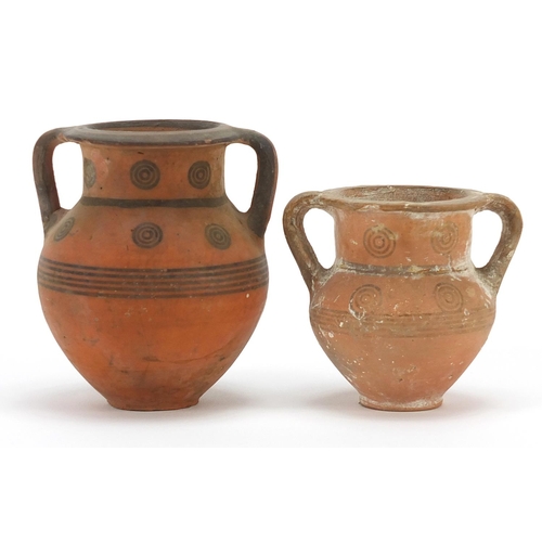 128 - Two Cypriot miniature pottery kraters with twin handles, the largest 9cm high