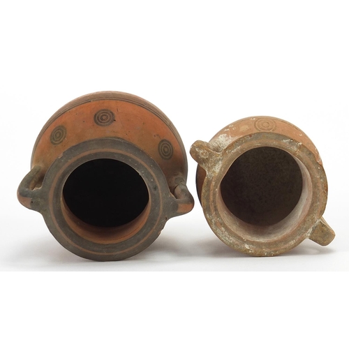 128 - Two Cypriot miniature pottery kraters with twin handles, the largest 9cm high