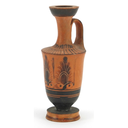 138 - Attic pottery lekythos hand painted with palmettes, 11cm high