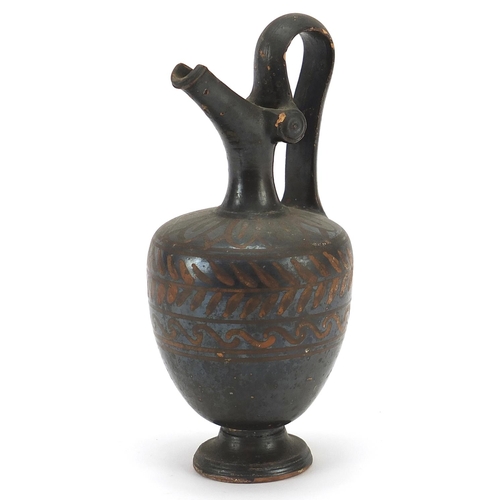 148 - South Italian pottery black ware oinochoe jug, 16cm high
