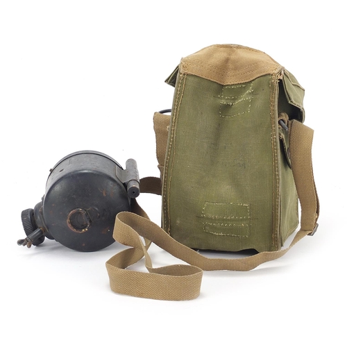 2456 - Military interest WW2 spot light with green canvas carrying bag dated 1944, the light 12.5cm high