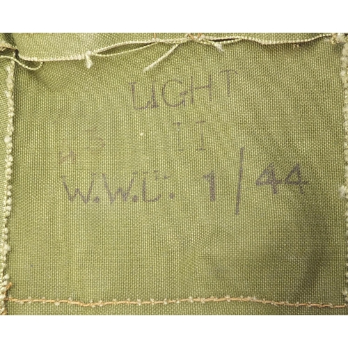 2456 - Military interest WW2 spot light with green canvas carrying bag dated 1944, the light 12.5cm high