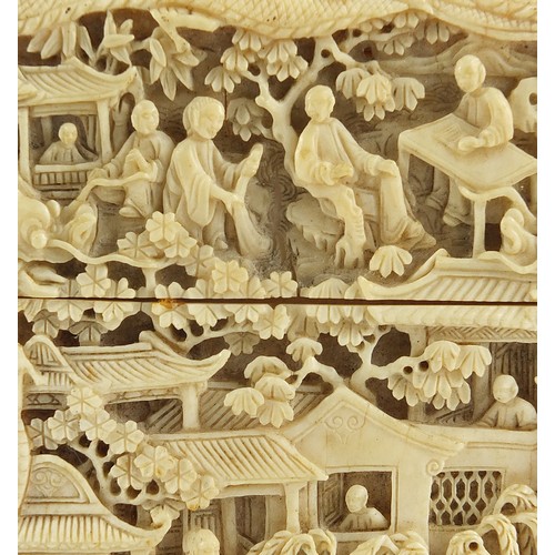 35 - Chinese Canton ivory card case finely and deeply carved with figures amongst pagodas, 10.5cm H x 6.5... 