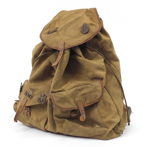 2464 - British military World War II canvas mountain backpack with cap badges including Australian Commonwe... 