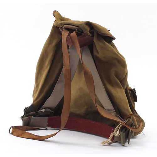 2464 - British military World War II canvas mountain backpack with cap badges including Australian Commonwe... 