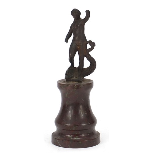 220 - Antique patinated bronze figure of a nude female upon a dolphin, raised on a marble base, possibly G... 