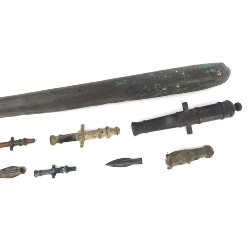 170 - Metal antiquities including spear heads and cannon barrels, the largest 27cm in length