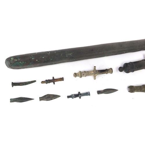 170 - Metal antiquities including spear heads and cannon barrels, the largest 27cm in length