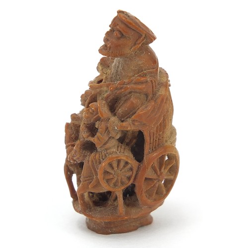 65 - Chinese objects to include a coquilla nut carved in the form of a cart being pulled by horses, white... 