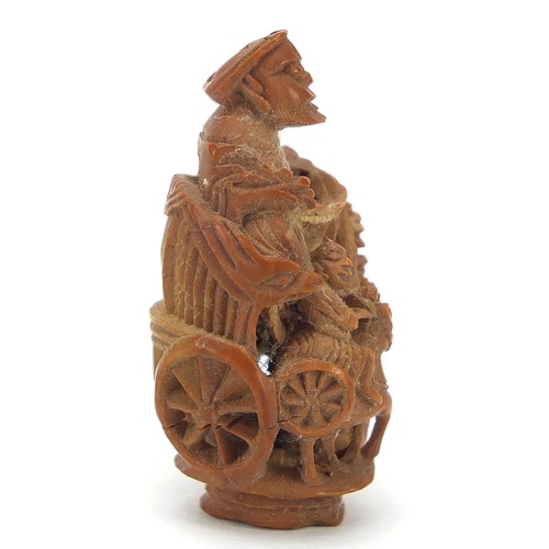 65 - Chinese objects to include a coquilla nut carved in the form of a cart being pulled by horses, white... 