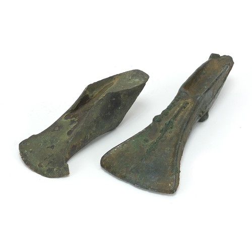 171 - Two antique patinated bronze axe heads, the largest 16cm in length