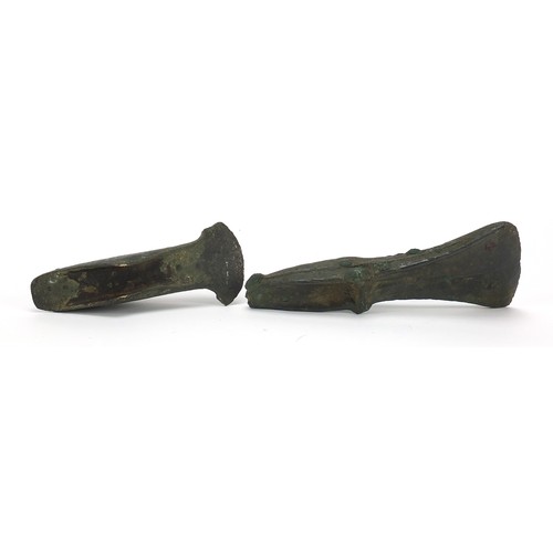 171 - Two antique patinated bronze axe heads, the largest 16cm in length