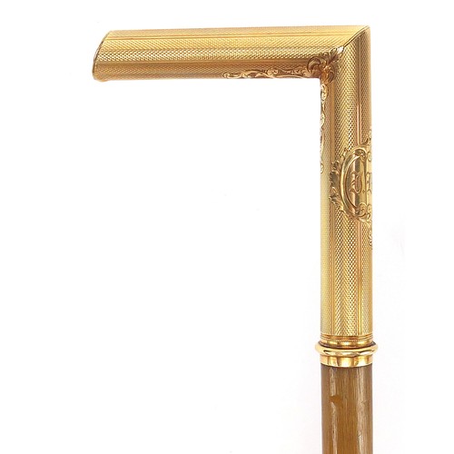 316 - Rhinoceros horn walking stick with unmarked 18ct gold mounts, 78cm in length