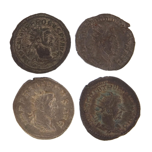 2518 - Four Roman silver and bronze coins, 14.8g, the largest 2.2cm in dimeter