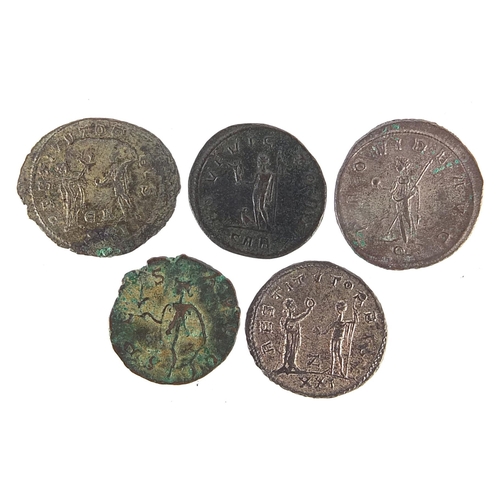 2519 - Five Roman bronze coins including Philip I and Trajan Decius examples, 17.5g, the largest 2.4cm in d... 