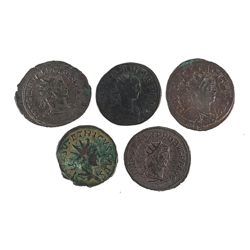 2519 - Five Roman bronze coins including Philip I and Trajan Decius examples, 17.5g, the largest 2.4cm in d... 