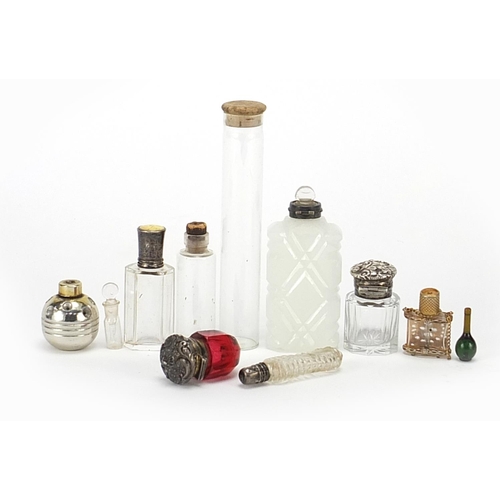 234 - 19th century and later glass perfume bottles, mainly having silver tops including a silver crown top... 