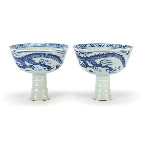 81 - Pair of Chinese blue and white stem cup with dragons, 12cm in diameter