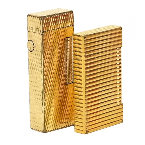 106 - Two boxed Dunhill and Dupont gold plated lighters, the largest 6.5cm in length