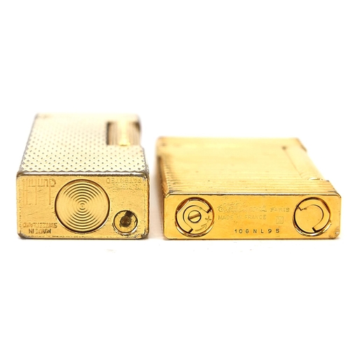 106 - Two boxed Dunhill and Dupont gold plated lighters, the largest 6.5cm in length