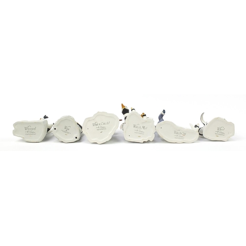 435 - Six Frankin Mint porcelain penguin groups, including two with Eskimo children, the largest 25cm in l... 