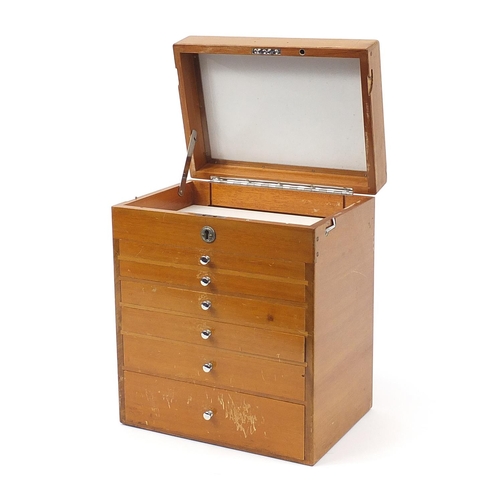 341 - Lightwood six drawer dentist's cabinet with a lift up top, 40cm H x 33cm W x 23cm D