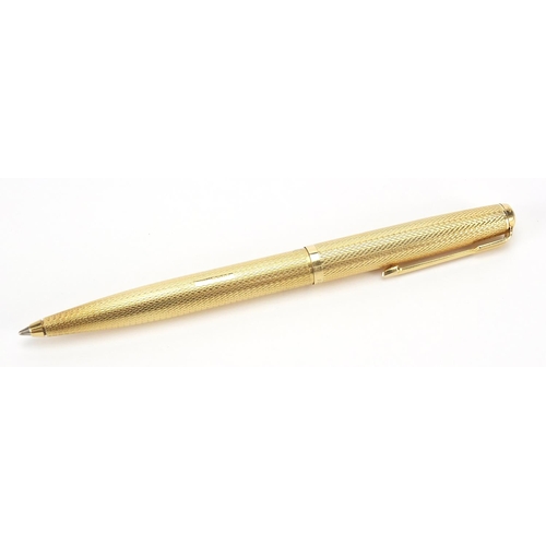 104 - 18ct gold Parker ballpoint pen with engine turned case, 24.2g