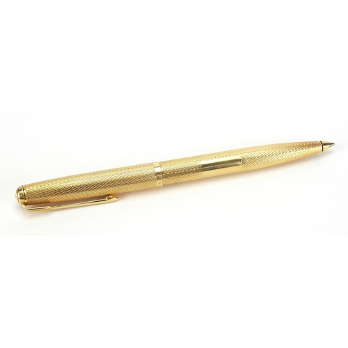 104 - 18ct gold Parker ballpoint pen with engine turned case, 24.2g