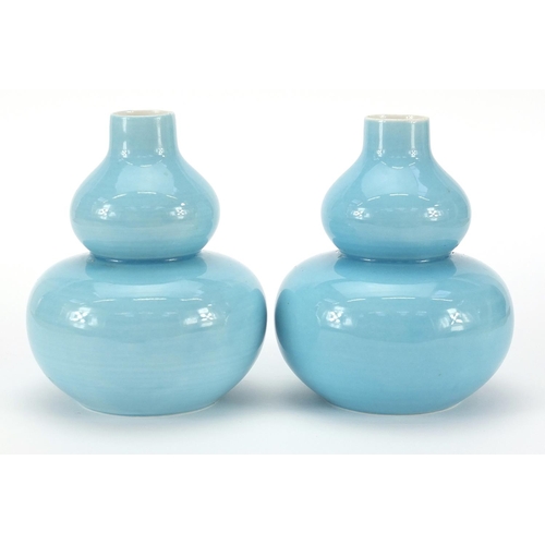 126 - Pair of Chinese porcelain double gourd vases having blue glazes and character marks to the bases, ea... 