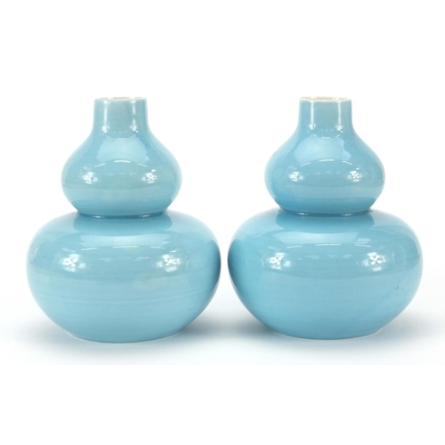 126 - Pair of Chinese porcelain double gourd vases having blue glazes and character marks to the bases, ea... 