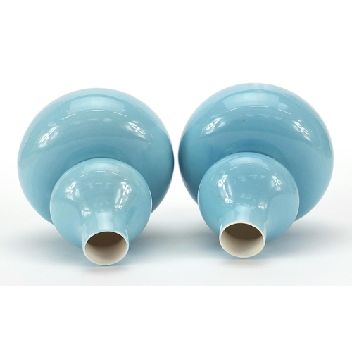 126 - Pair of Chinese porcelain double gourd vases having blue glazes and character marks to the bases, ea... 