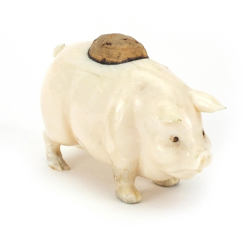 98 - Carved ivory pin cushion in the form of a pig, 6.5cm in length