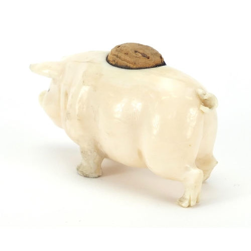 98 - Carved ivory pin cushion in the form of a pig, 6.5cm in length