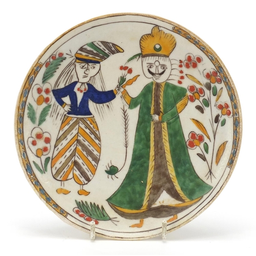 130 - Turkish Kutahya pottery plate hand painted with figures, 17cm in diameter