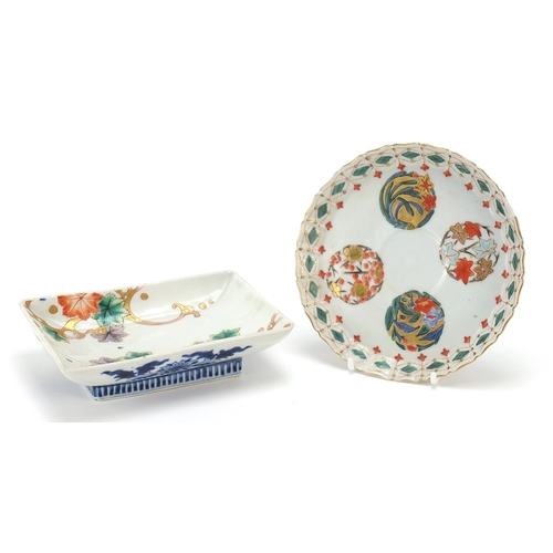 297 - Two Japanese porcelain footed dishes hand painted with flowers, the largest 15cm wide