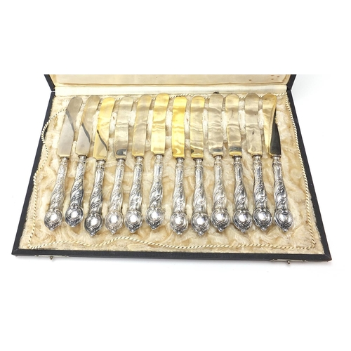 2199 - Set of twelve German 800 silver handled knives with fitted case, 20.5cm in length