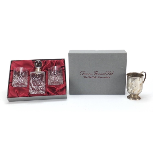 2197 - Francis Howard cut glass bottle and two glasses with silver collar and a silver cup, the cup 8.5cm h... 