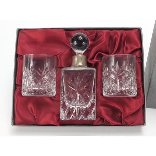 2197 - Francis Howard cut glass bottle and two glasses with silver collar and a silver cup, the cup 8.5cm h... 