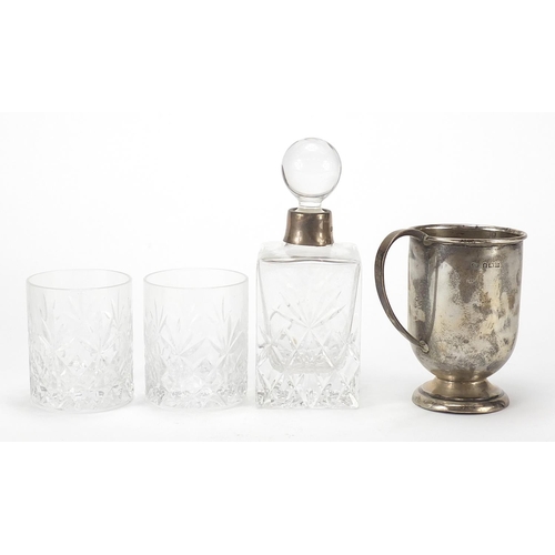 2197 - Francis Howard cut glass bottle and two glasses with silver collar and a silver cup, the cup 8.5cm h... 