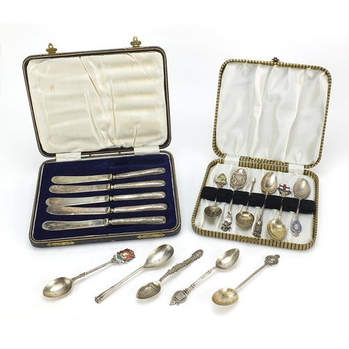 2206 - Nine silver souvenir teaspoons, two white metal souvenir teaspoons and five silver handled butter kn... 