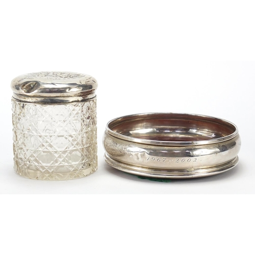 2212 - Circular silver and oak wine coaster and a cut glass jar with silver lid embossed with Putti, variou... 