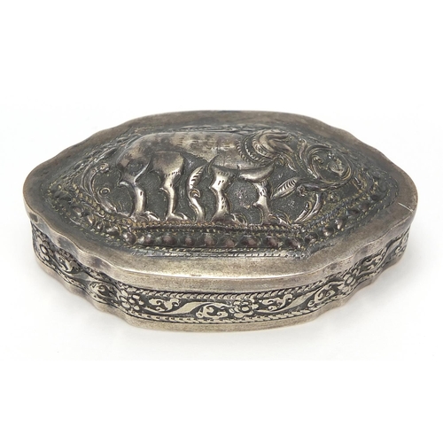 2195 - Indian unmarked silver snuff box, the hinged lid embossed with a mythical animal, 6.5cm wide, 29.2g